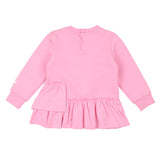 Pink dress with ruffled skirt on a white background